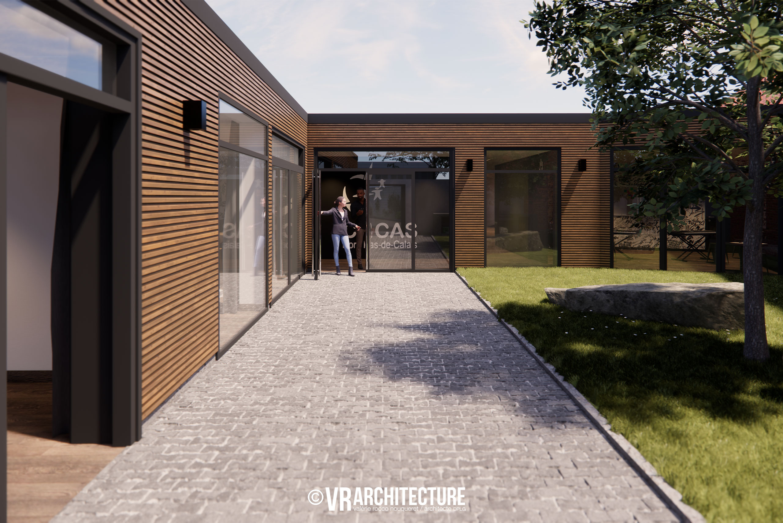 Entrée du nouveau local d'activité aménagé dans  un bâtiment réhabilité.